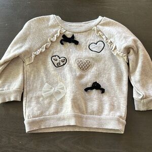 Nannette Cream and Black Heart Sweatshirt with Ruffle Details
